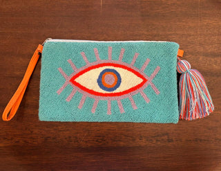 LE POM POM TURQUOISE & PURPLE EYE CLUTCH