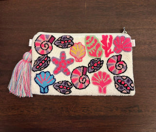 LE POM POM WHITE SHELLS CLUTCH